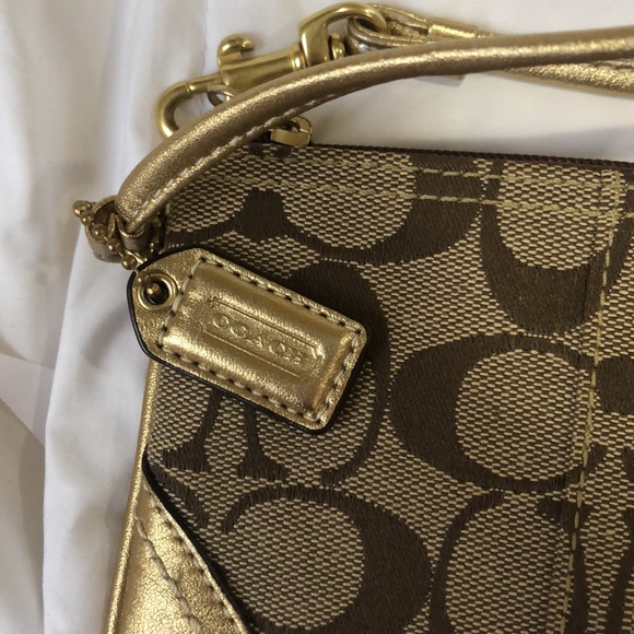 Tan and gold Coach wristlet with purple lining - Picture 3 of 4